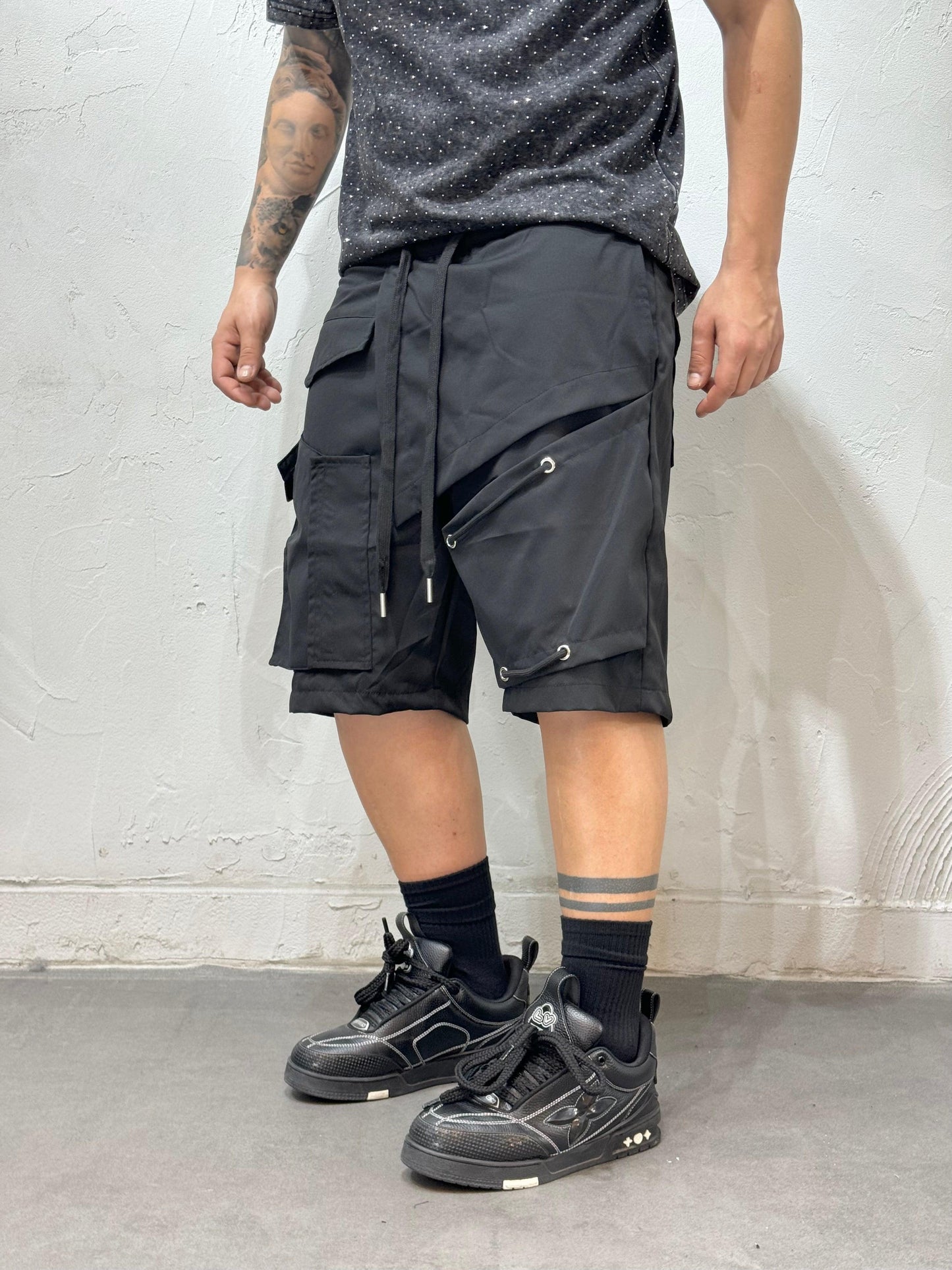 CROOKED CUTS BLACK BERMUDA SHORTS